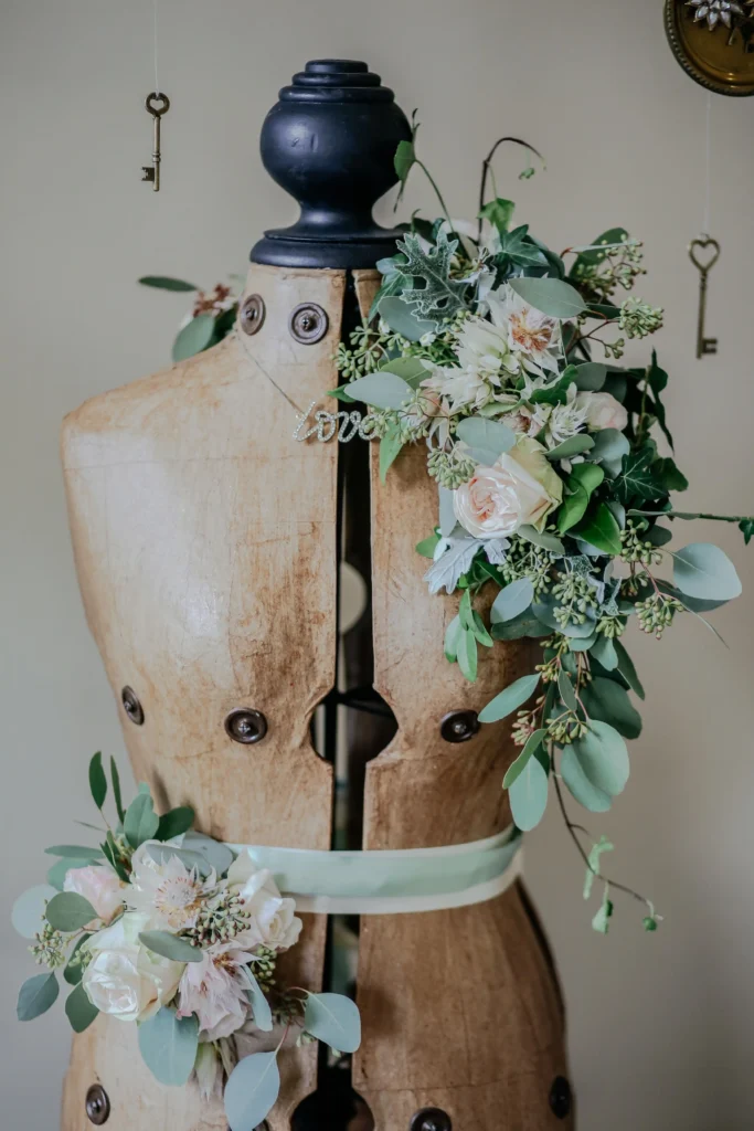 Dress form with floral accessories