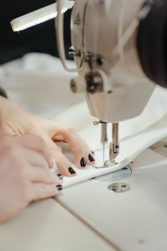Sewing machine stitching wedding dress fabric